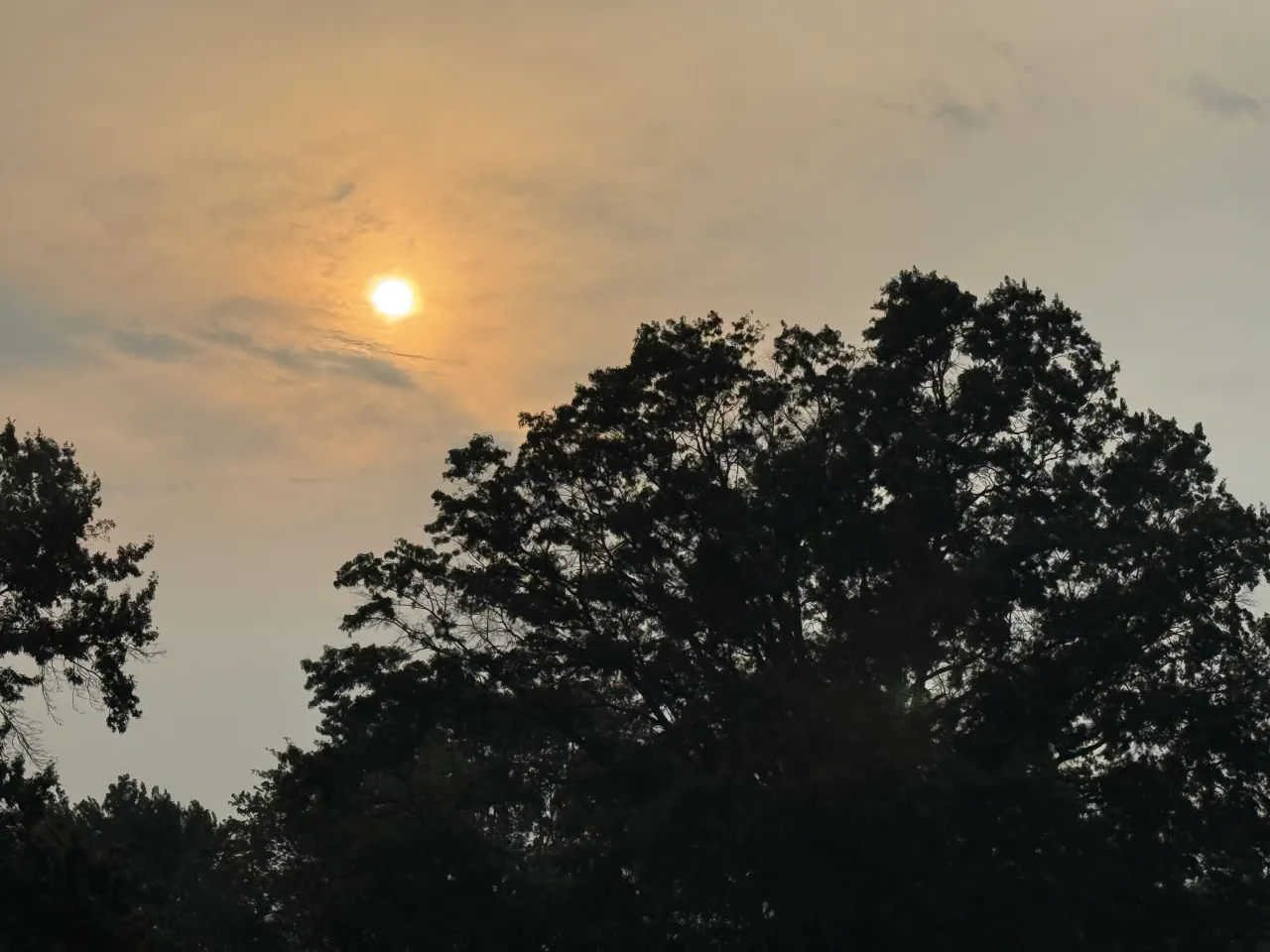 Smoke-tinted skies over Lawrence Township in the evening on July 15, 2026.