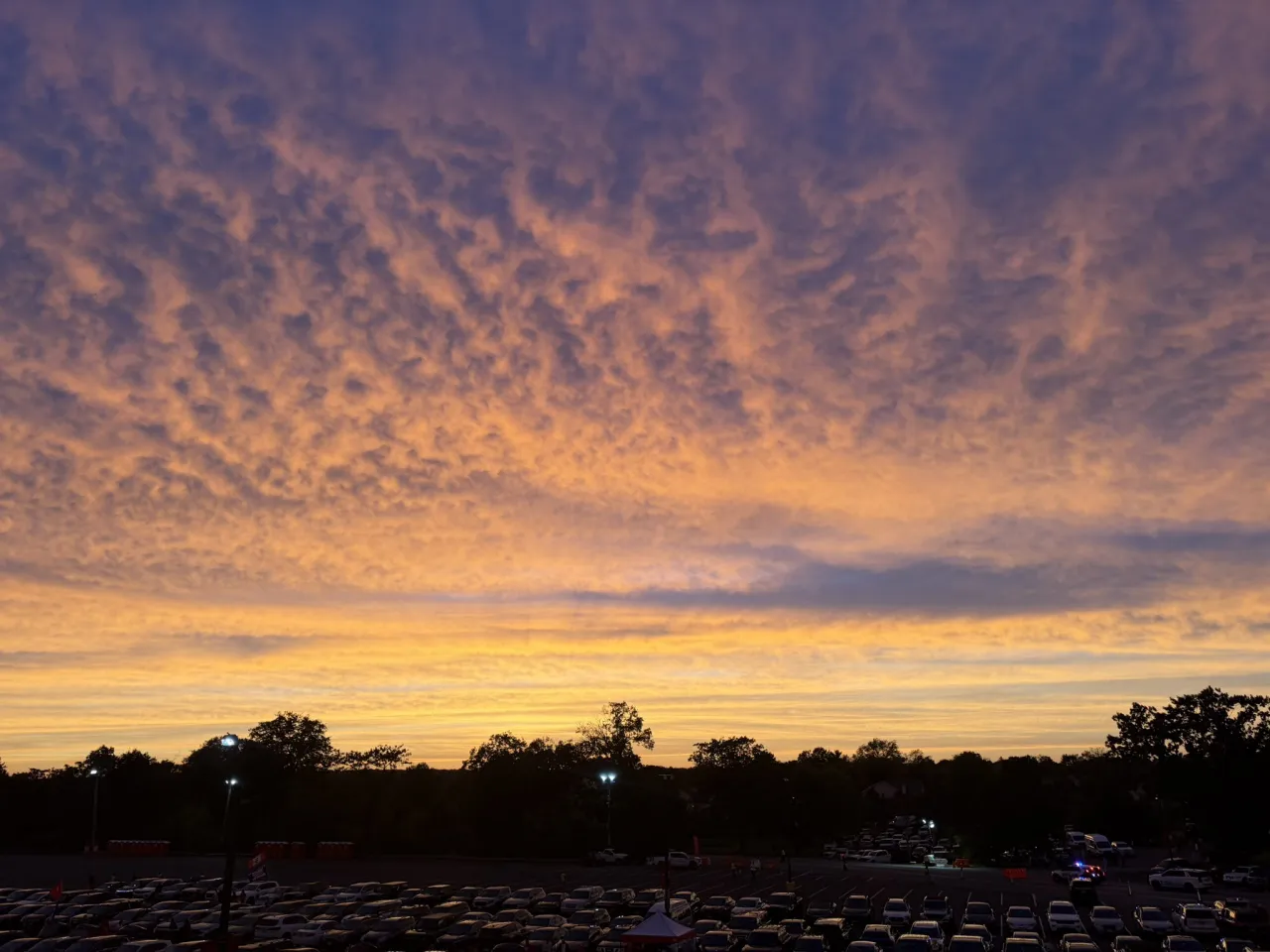 Photo of a vibrant sunset ahead of the nor'easter over the parking lot outside SHI Stadium in Piscataway on September 25th. 