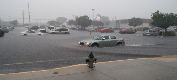 Photo of flash flooding in a parking lot