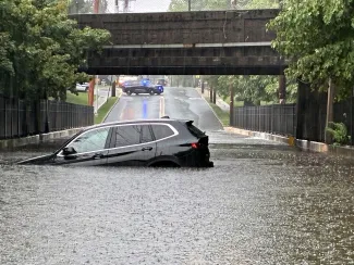 Photo showing a vehicle trapped in flood waters in Glen Rock on July 27. 